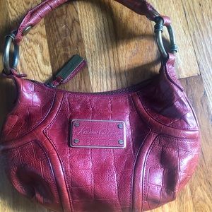 Burgundy Kenneth Cole purse.